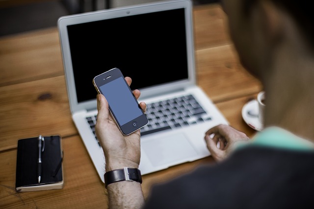 Man Using Devices