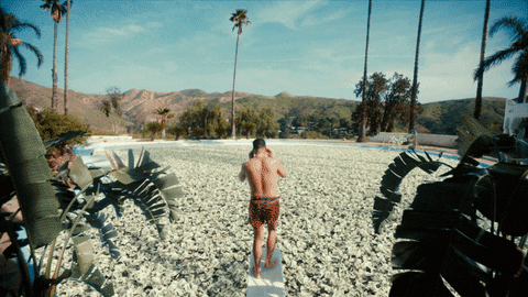 Man diving into pool of money